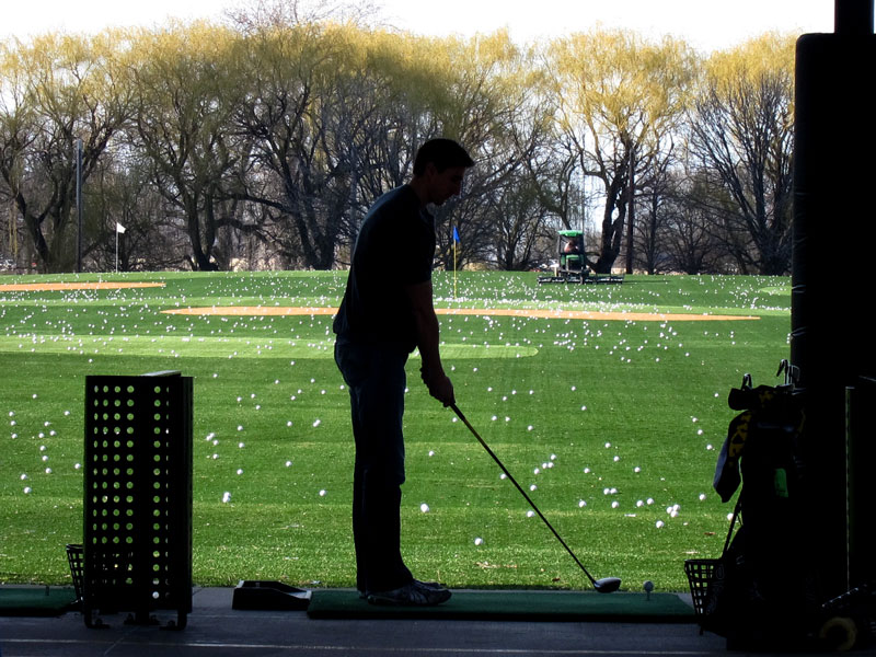 Silhouette of golfer at Lincoln Park Driving Range